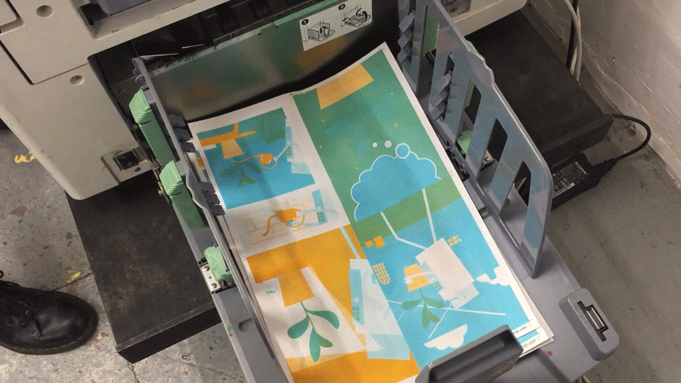 Riso prints coming out of the machine